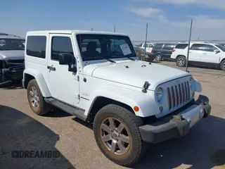 2015 Jeep Wrangler Sahara z VIN 1C4AJWBG1FL581272, wystawiony jako IAAI lot #41918942 z przebiegiem 94 849 mil mil oraz . Historia ofert i sprzedaży dostępna na DreamBid. Obrazek 1.