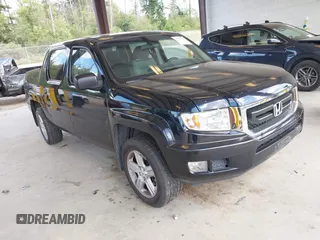 2009 Honda Ridgeline RT with VIN 5FPYK16229B101199, listed as a IAAI auction lot 42642111 with 199,493 mi miles and . Bid and sale history available at DreamBid. Image 1.