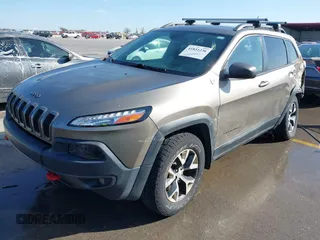 2017 Jeep Cherokee Trailhawk L Plus with VIN 1C4PJMBB6HW654172, listed as a IAAI auction lot 41851236 with 104,263 mi miles. Bid and sale history available at carsss.com. Image 17.