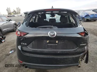 2021 Mazda CX-5 Sport with VIN JM3KFABM3M1334284, listed as a Copart auction lot 86915194 with 0 mi miles and Salvage Title. Bid and sale history available at carsss.com. Image 6.