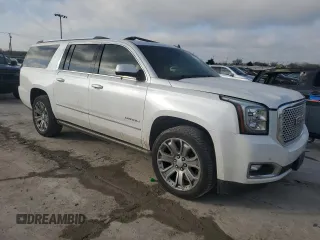 2016 GMC Yukon XL Denali with VIN 1GKS2HKJXGR220635, listed as a Copart auction lot 48920655 with 113,924 mi miles and Salvage Title. Bid and sale history available at DreamBid. Image 4.
