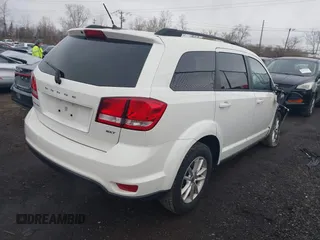 2014 Dodge Journey SXT with VIN 3C4PDCBB8ET153190, listed as a IAAI auction lot 41854655 with 153,048 mi miles and . Bid and sale history available at DreamBid. Image 4.