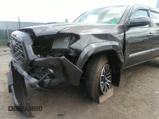 2021 Toyota Tacoma SR z VIN 3TYCZ5AN7MT017377, wystawiony jako IAAI lot #42285326 z przebiegiem 91 657 mil mil oraz . Historia ofert i sprzedaży dostępna na DreamBid. Obrazek 6.