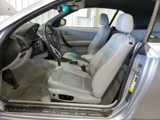 2011 BMW 1 Series 128i with VIN WBAUL7C57BVM80274, listed as a Copart auction lot 52127595 with 104,952 mi miles and Salvage title. Bid and sale history available at DreamBid. Image 7.