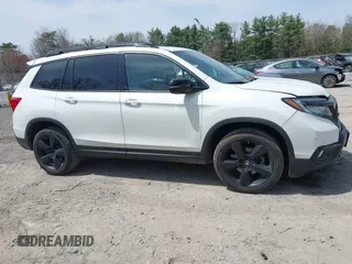 2021 Honda Passport Elite z VIN 5FNYF8H08MB014739, wystawiony jako IAAI lot #42137913 z przebiegiem 50 580 mil mil oraz . Historia ofert i sprzedaży dostępna na DreamBid. Obrazek 13.