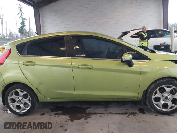2011 Ford Fiesta SES with VIN 3FADP4FJ7BM127600, listed as a IAAI auction lot 41657170 with 135,483 mi miles. Bid and sale history available at carsss.com. Image 14.