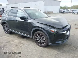 2018 Mazda CX-5 Grand Touring with VIN JM3KFBDM1J0358197, listed as a IAAI auction lot 41967940 with 148,119 mi miles and . Bid and sale history available at DreamBid. Image 1.