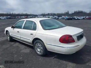 1998 Lincoln Continental with VIN 1LNFM97V2WY738814, listed as a IAAI auction lot 41992844 with 147,066 mi miles. Bid and sale history available at carsss.com. Image 3.