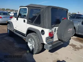 2005 Jeep Wrangler SE with VIN 1J4FA29S95P363770, listed as a IAAI auction lot 41362056 with 140,540 mi miles. Bid and sale history available at carsss.com. Image 3.
