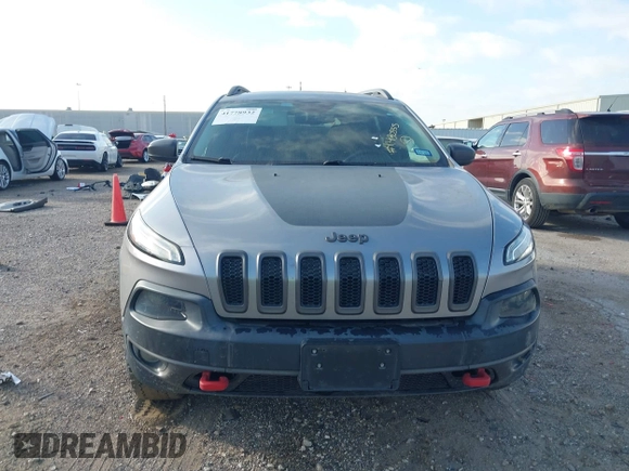 2015 Jeep Cherokee Trailhawk with VIN 1C4PJMBS3FW662307, listed as a IAAI auction lot 41778932 with 64,569 mi miles. Bid and sale history available at carsss.com. Image 12.