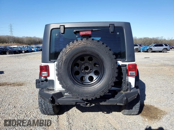 2012 Jeep Wrangler Unlimited Sport with VIN 1C4BJWDG2CL257437, listed as a Copart auction lot 49257965 with 141,695 mi miles and Clean title. Bid and sale history available at DreamBid. Image 6.