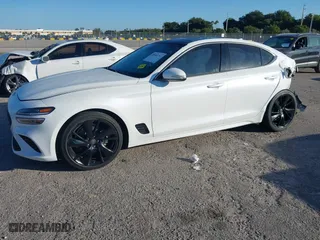 2023 Genesis G70 2.0T with VIN KMTG34TA9PU110258, listed as a IAAI auction lot 40985797 with 23,422 mi miles. Bid and sale history available at carsss.com. Image 18.