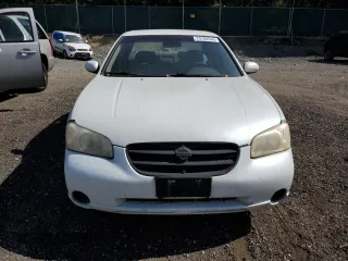 2000 Nissan Maxima GXE z VIN JN1CA31D0YT743476, wystawiony jako Copart lot #70160544 z przebiegiem 225 499 mil mil oraz Szkoda całkowita • Salvage title. Historia ofert i sprzedaży dostępna na DreamBid. Obrazek 5.