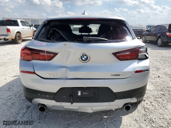 2021 BMW X2 sDrive28i with VIN WBXYH9C04M5S06770, listed as a Copart auction lot 69489874 with 27,076 mi miles and Salvage Title. Bid and sale history available at carsss.com. Image 6.