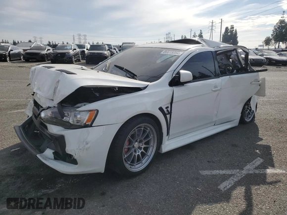 2014 Mitsubishi Lancer Evolution GSR z VIN JA32W8FV2EU019253, wystawiony jako Copart lot #86615084 z przebiegiem 104 894 mil mil oraz Szkody całkowita. Historia ofert i sprzedaży dostępna na DreamBid. Obrazek 1.