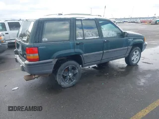 1993 Jeep Grand Cherokee Laredo with VIN 1J4GZ58Y9PC583439, listed as a IAAI auction lot 41794732 with 211,691 mi miles and . Bid and sale history available at DreamBid. Image 4.