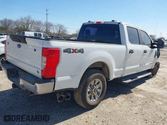 2021 Ford Super Duty F-250 SRW XL with VIN 1FT7W2BT2MEC37128, listed as a IAAI auction lot 41735304 with 103,992 mi miles. Bid and sale history available at carsss.com. Image 4.