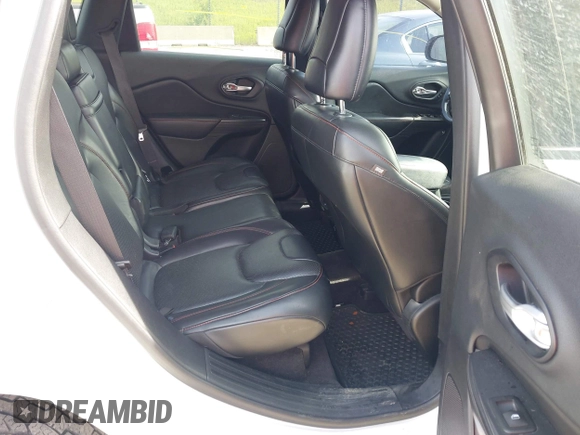 2015 Jeep Cherokee Trailhawk with VIN 1C4PJMBS6FW687718, listed as a IAAI auction lot 42505169 with 122,526 mi miles and . Bid and sale history available at DreamBid. Image 8.