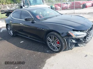 2018 Maserati Ghibli with VIN ZAM57XSA7J1271113, listed as a IAAI auction lot 42550278 with 124,271 mi miles and . Bid and sale history available at DreamBid. Image 1.