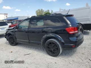 2017 Dodge Journey SXT with VIN 3C4PDCBBXHT701338, listed as a Copart auction lot 48244005 with 66,418 mi miles and Salvage Title. Bid and sale history available at DreamBid. Image 2.