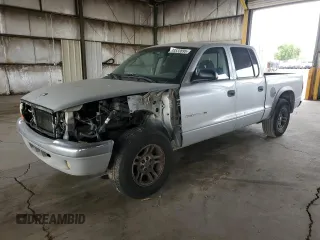 2002 Dodge Dakota SLT z VIN 1B7HL48N42S519724, wystawiony jako Copart lot #55533895 z przebiegiem 313 644 mil mil oraz Tytuł czysty. Historia ofert i sprzedaży dostępna na DreamBid. Obrazek 1.