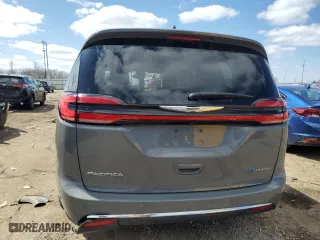 2023 Chrysler Pacifica Hybrid Touring L with VIN 2C4RC1L7XPR572495, listed as a Copart auction lot 51464745 with 33,397 mi miles and Clean Title. Bid and sale history available at carsss.com. Image 6.