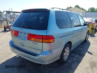 2003 Honda Odyssey EX-L with VIN 5FNRL18973B148675, listed as a IAAI auction lot 41992952 with 232,013 mi miles and . Bid and sale history available at DreamBid. Image 4.