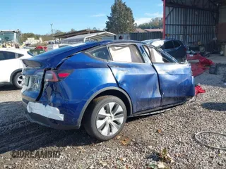 2024 Tesla Model Y Long Range with VIN 7SAYGDEEXRA265159, listed as a IAAI auction lot 40907008 with Not Provided miles and . Bid and sale history available at DreamBid. Image 4.