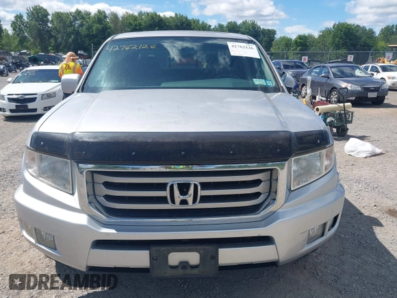 2013 Honda Ridgeline RTL with VIN 5FPYK1F51DB007236, listed as a IAAI auction lot 42762126 with 201,758 mi miles and . Bid and sale history available at DreamBid. Image 12.