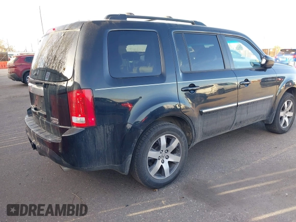 2012 Honda Pilot Touring with VIN 5FNYF4H93CB077057, listed as a IAAI auction lot 41156160 with 139,834 mi miles and . Bid and sale history available at DreamBid. Image 4.
