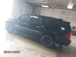 2010 Chevrolet Suburban LTZ with VIN 1GNUKKE39AR106851, listed as a IAAI auction lot 41994155 with 148,776 mi miles. Bid and sale history available at carsss.com. Image 3.