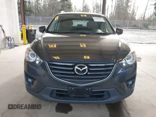 2016 Mazda CX-5 Touring with VIN JM3KE4CY4G0779827, listed as a IAAI auction lot 41840727 with 91,367 mi miles. Bid and sale history available at carsss.com. Image 13.