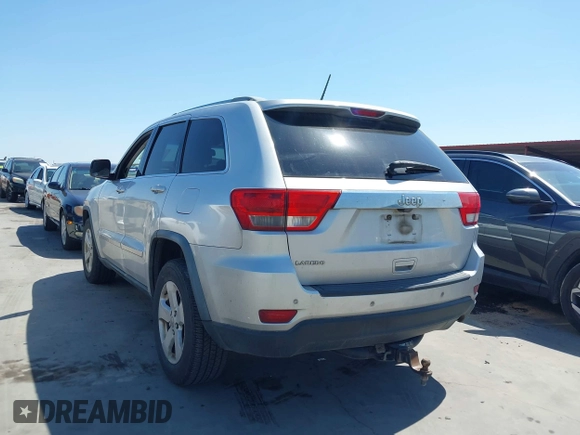 2012 Jeep Grand Cherokee Laredo with VIN 1C4RJEAG5CC112230, listed as a IAAI auction lot 41997483 with 302,923 mi miles. Bid and sale history available at carsss.com. Image 3.