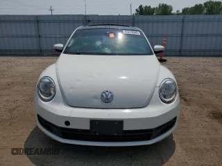 2013 Volkswagen Beetle with VIN 3VWHX7AT2DM656457, listed as a Copart auction lot 63814944 with 92,966 mi miles and Salvage Title. Bid and sale history available at DreamBid. Image 5.