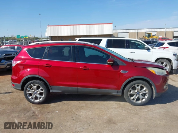 2014 Ford Escape Titanium with VIN 1FMCU0J91EUE12034, listed as a IAAI auction lot 42027493 with 160,417 mi miles and . Bid and sale history available at DreamBid. Image 13.
