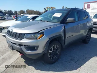 2019 Jeep Compass Trailhawk with VIN 3C4NJDDBXKT627350, listed as a IAAI auction lot 41803263 with 63,768 mi miles and . Bid and sale history available at DreamBid. Image 2.