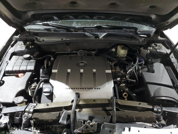2010 Cadillac DTS 1SC z VIN 1G6KD5EY7AU128077, wystawiony jako Copart lot #58089475 z przebiegiem 203 830 mil mil oraz Szkody całkowita. Historia ofert i sprzedaży dostępna na DreamBid. Obrazek 11.