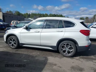 2019 BMW X1 xDrive28i with VIN WBXHT3C56K5L35842, listed as a IAAI auction lot 41981409 with 54,325 mi miles. Bid and sale history available at carsss.com. Image 14.