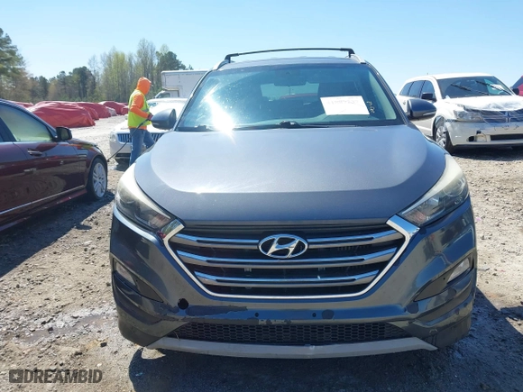 2017 Hyundai Tucson Value with VIN KM8J33A23HU405296, listed as a IAAI auction lot 41887237 with 114,027 mi miles. Bid and sale history available at carsss.com. Image 12.
