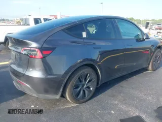 2024 Tesla Model Y with VIN 7SAYGDED3RA329355, listed as a IAAI auction lot 42343269 with 8,334 mi miles and . Bid and sale history available at DreamBid. Image 4.