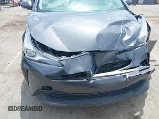 2021 Toyota Prius L Eco z VIN JTDKAMFU3M3152785, wystawiony jako IAAI lot #42501351 z przebiegiem 60 489 mil mil oraz . Historia ofert i sprzedaży dostępna na DreamBid. Obrazek 6.