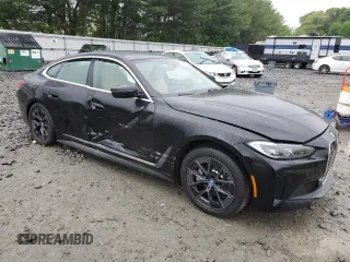 2024 BMW i4 eDrive35 with VIN WBY43AW05RFS84773, listed as a Copart auction lot 54974024 with 2,942 mi miles and Salvage Title. Bid and sale history available at carsss.com. Image 4.