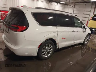 2021 Chrysler Pacifica Touring L with VIN 2C4RC1BG3MR504293, listed as a IAAI auction lot 41728608 with 70,487 mi miles and . Bid and sale history available at DreamBid. Image 18.