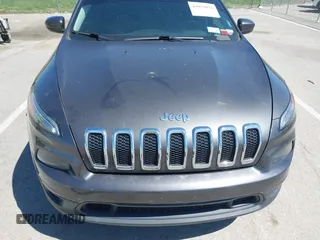 2014 Jeep Cherokee Latitude with VIN 1C4PJMCS2EW137767, listed as a IAAI auction lot 42052071 with 165,300 mi miles and . Bid and sale history available at DreamBid. Image 6.