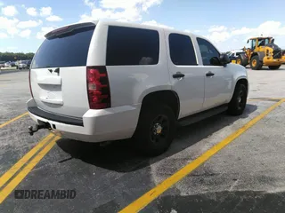 2011 Chevrolet Tahoe Commercial with VIN 1GNLC2E02BR325621, listed as a IAAI auction lot 41866389 with 167,693 mi miles and . Bid and sale history available at DreamBid. Image 4.