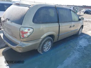 2001 Dodge Caravan Sport with VIN 2B8GP44G21R129935, listed as a IAAI auction lot 42009037 with Not Provided miles and . Bid and sale history available at carsss.com. Image 4.