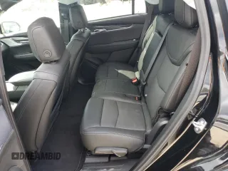 2024 Cadillac XT6 AWD Sport z VIN 1GYKPGRS6RZ749292, wystawiony jako Copart lot #50844795 z przebiegiem 12 972 mil mil oraz Szkoda całkowita • Salvage title. Historia ofert i sprzedaży dostępna na DreamBid. Obrazek 12.
