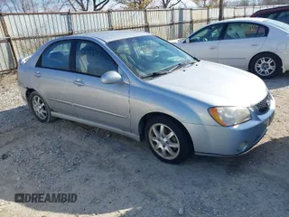 2006 Kia Spectra EX with VIN KNAFE121065372261, listed as a IAAI auction lot 41707311 with 237,555 mi miles. Bid and sale history available at carsss.com. Image 1.