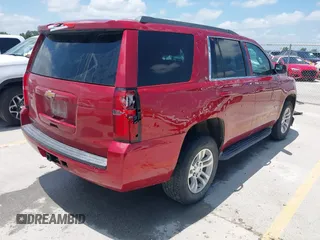 2015 Chevrolet Tahoe LS with VIN 1GNSCAEC4FR121571, listed as a IAAI auction lot 42499156 with 131,284 mi miles and . Bid and sale history available at DreamBid. Image 4.