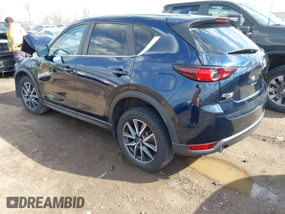 2018 Mazda CX-5 Touring with VIN JM3KFBCM5J0369799, listed as a IAAI auction lot 41895364 with 76,801 mi miles and . Bid and sale history available at carsss.com. Image 3.